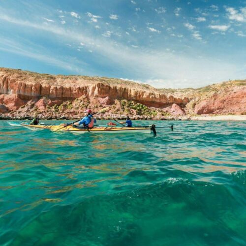sea kayaking by the rugged landscape in baja sea kayaking by the rugged landscape in baja