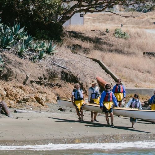kayaks putting their boats back in at angel island kayaks putting their boats back in at angel island