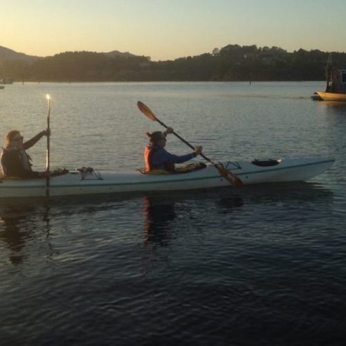 tandem sea kayaking at sunset tandem sea kayaking at sunset