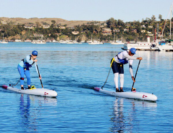 Intermediate Stand-Up Paddleboard class at Sea Trek where the instructor is teaching the student better technique.