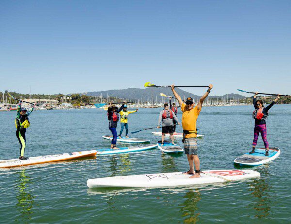 Group of Stand Up Paddleboarders heading out into Richardson Bay on their Sausalito SUP Tour